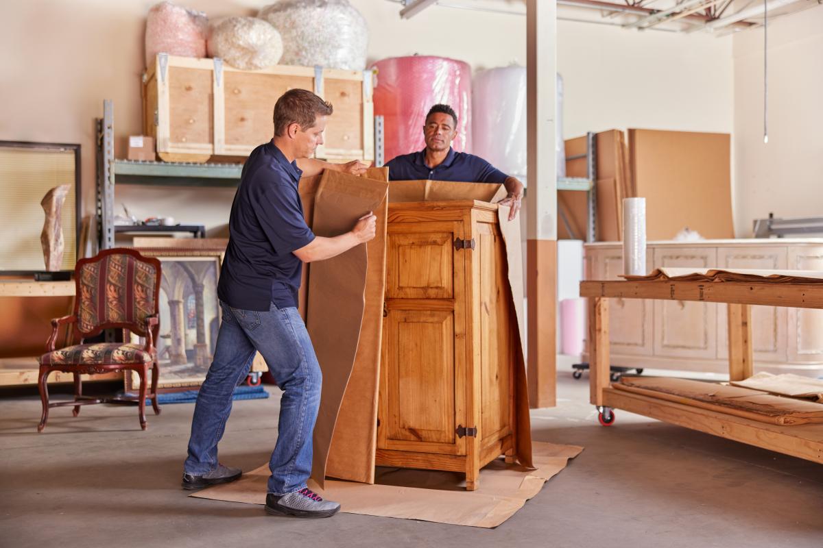 Professional packing of a dresser for estate furniture shipping